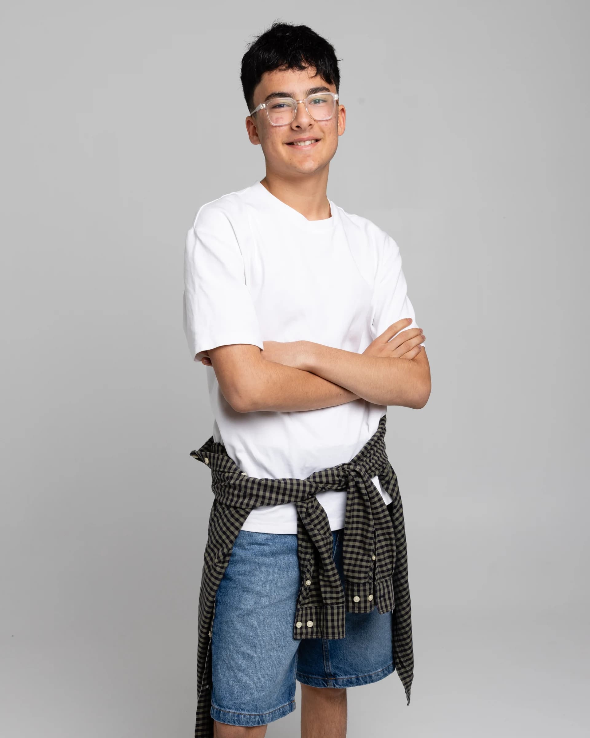 NVA young artist smiling with arms folded
