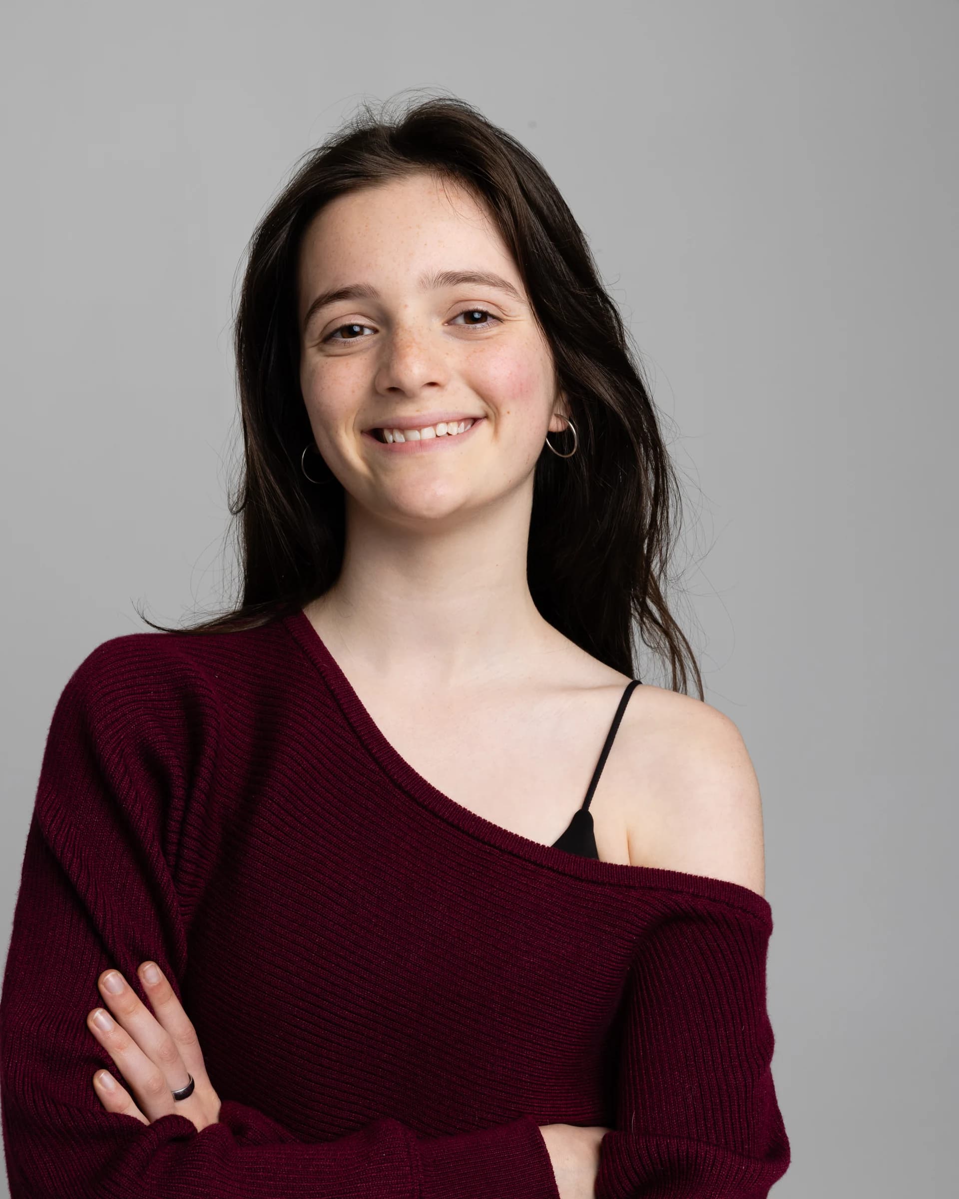 Portrait of an NVA young artist in a burgundy top